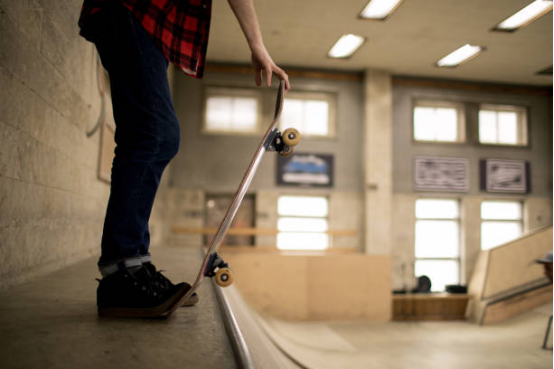 Rider practicing balance on a longboard trainer