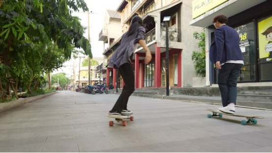 Social gathering of longboarders in a skate park, enjoying the weekend challenge.